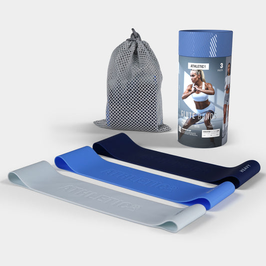 Resistance bands with packaging and drawstring bag on a light grey background